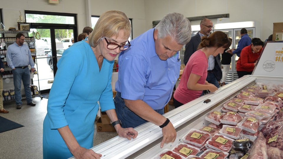 Lt. Gov. Suzanne Crouch and ISDA Director Bruce Kettler view some of the products available at Sander Processing in Celestine, Indiana. (IIB photo by Wes Mills)